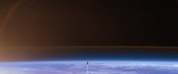 Movie still from “65” (2023), directed by Bryan Woods – An image taken from an airplane looking out at the earth; Extreme Wide shot, Overhead angle