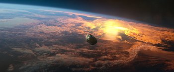 Movie still from “65” (2023), directed by Bryan Woods – An object floating in the air above the earth; Extreme Wide shot, High angle