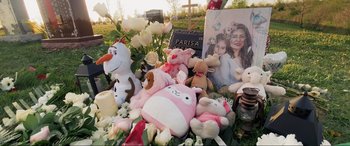 Movie still from “752 Is Not a Number” (2022), directed by Babak Payami – A bunch of stuffed animals are laying on the ground; Medium shot, Over the shoulder angle