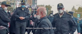 Movie still from “752 Is Not a Number” (2022), directed by Babak Payami – Medium shot, Over the shoulder angle