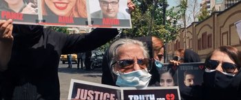 Movie still from “752 Is Not a Number” (2022), directed by Babak Payami – Medium shot, High angle