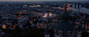 Movie still from “752 Is Not a Number” (2022), directed by Babak Payami – An aerial view of a city at night with a ferris wheel; Extreme Wide shot, Low angle