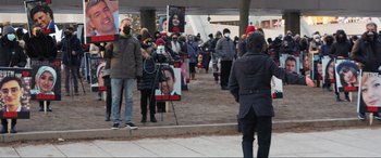 Movie still from “752 Is Not a Number” (2022), directed by Babak Payami – A group of people lined up to vote; Extreme Wide shot, High angle