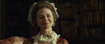 Movie still from “The Duchess” (2008), directed by Saul Dibb – An older woman wearing a dress and a hat; Close Up shot, Low angle