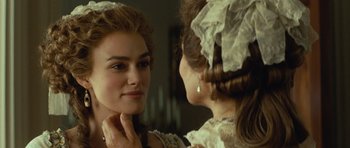 Movie still from “The Duchess” (2008), directed by Saul Dibb – A young woman looking at her reflection in a mirror; Close Up shot, Over the shoulder angle