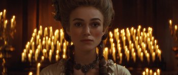 Movie still from “The Duchess” (2008), directed by Saul Dibb – A person wearing a necklace; Close Up shot, Over the shoulder angle