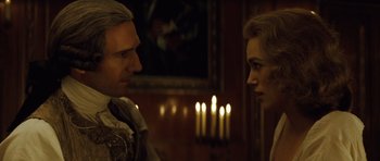 Movie still from “The Duchess” (2008), directed by Saul Dibb – A man and a woman standing next to each other in front of candles; Close Up shot, Over the shoulder angle