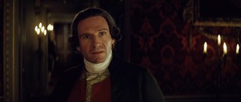 Movie still from “The Duchess” (2008), directed by Saul Dibb – A person wearing a suit and tie; Close Up shot, Over the shoulder angle