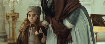 Movie still from “The Duchess” (2008), directed by Saul Dibb – A young girl dressed in medieval clothing holding a sword; Close Up shot, Over the shoulder angle