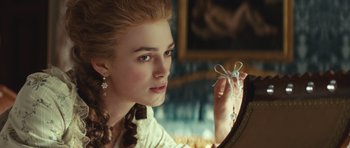 Movie still from “The Duchess” (2008), directed by Saul Dibb – A young woman looking at herself in a mirror; Close Up shot, Over the shoulder angle