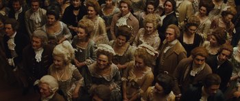 Movie still from “The Duchess” (2008), directed by Saul Dibb – A group of people dressed in period clothing; Wide shot, High angle