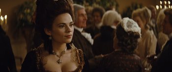 Movie still from “The Duchess” (2008), directed by Saul Dibb – A woman in a renaissance dress is looking at the camera; Close Up shot, Over the shoulder angle