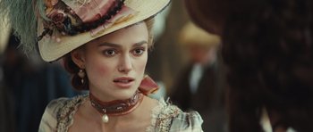 Movie still from “The Duchess” (2008), directed by Saul Dibb – A person wearing a hat; Close Up shot, Over the shoulder angle
