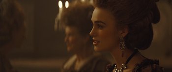 Movie still from “The Duchess” (2008), directed by Saul Dibb – A woman in a black dress and a man in a black suit; Close Up shot, Over the shoulder angle