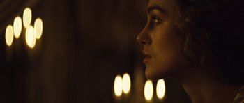 Movie still from “The Duchess” (2008), directed by Saul Dibb – A woman's face in the dark; Close Up shot, Over the shoulder angle