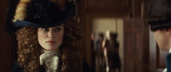 Movie still from “The Duchess” (2008), directed by Saul Dibb – A person wearing a hat; Close Up shot, Over the shoulder angle