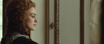 Movie still from “The Duchess” (2008), directed by Saul Dibb – A woman standing in front of a mirror in front of a wall; Close Up shot, Over the shoulder angle