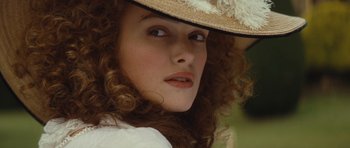 Movie still from “The Duchess” (2008), directed by Saul Dibb – A person wearing a hat; Close Up shot, Over the shoulder angle