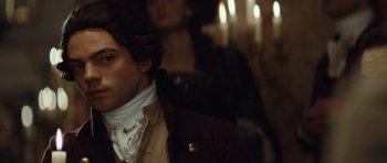 Movie still from “The Duchess” (2008), directed by Saul Dibb – A person wearing a coat and tie; Close Up shot, Over the shoulder angle