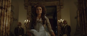 Movie still from “The Duchess” (2008), directed by Saul Dibb – A young woman in a long dress and a long hair style; Medium shot, Low angle