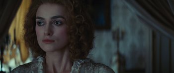 Movie still from “The Duchess” (2008), directed by Saul Dibb – A person with curly red hair; Close Up shot, Over the shoulder angle