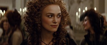 Movie still from “The Duchess” (2008), directed by Saul Dibb – A person with curly hair; Close Up shot, Over the shoulder angle