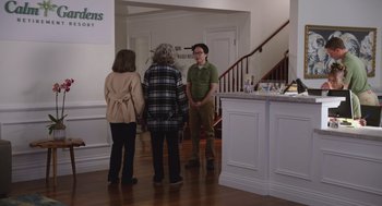Movie still from “80 for Brady” (2023), directed by Kyle Marvin – Three people standing in a room talking to each other; Wide shot, Over the shoulder angle