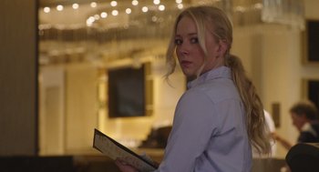 Movie still from “80 for Brady” (2023), directed by Kyle Marvin – A woman holding a tablet in her hands; Close Up shot, Low angle