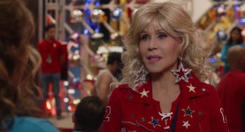 Movie still from “80 for Brady” (2023), directed by Kyle Marvin – A woman in a red jacket with stars on it; Close Up shot, Over the shoulder angle