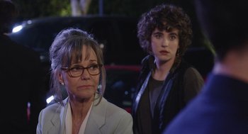 Movie still from “80 for Brady” (2023), directed by Kyle Marvin – A woman and a woman standing next to each other in front of a car; Close Up shot, Over the shoulder angle