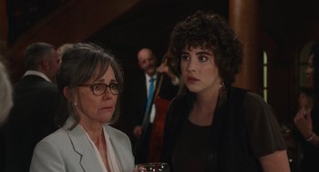 Movie still from “80 for Brady” (2023), directed by Kyle Marvin – A woman and a man are standing next to each other; Close Up shot, Over the shoulder angle