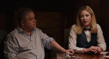 Movie still from “80 for Brady” (2023), directed by Kyle Marvin – A man and a woman sitting at a table; Medium shot, Over the shoulder angle