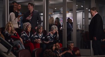 Movie still from “80 for Brady” (2023), directed by Kyle Marvin – A group of people sitting in chairs in a room; Medium shot, High angle