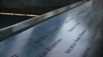 Movie still from “9/11: Inside the President's War Room” (2021), directed by Adam Wishart – The names of people who have passed away; Extreme Close Up shot, High angle