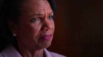 Movie still from “9/11: Inside the President's War Room” (2021), directed by Adam Wishart – A person looking at the camera; Close Up shot, High angle
