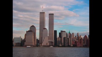Movie still from “9/11: Inside the President's War Room” (2021), directed by Adam Wishart – A view of the skyline of new york from the water; Extreme Wide shot, Low angle
