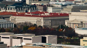 Movie still from “9/11: Inside the President's War Room” (2021), directed by Adam Wishart – A view of a large city from a high point; Extreme Wide shot, Low angle