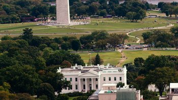 Movie still from “9/11: Inside the President's War Room” (2021), directed by Adam Wishart – A view of the white house and the washington monument; Extreme Wide shot, High angle