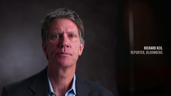 Movie still from “9/11: Inside the President's War Room” (2021), directed by Adam Wishart – A person wearing a suit and tie; Close Up shot, High angle