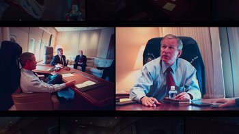Movie still from “9/11: Inside the President's War Room” (2021), directed by Adam Wishart – A group of people sitting around a table; Medium shot, Over the shoulder angle