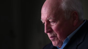 Movie still from “9/11: Inside the President's War Room” (2021), directed by Adam Wishart – An older man looking off into the distance; Close Up shot, High angle