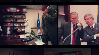 Movie still from “9/11: Inside the President's War Room” (2021), directed by Adam Wishart – A collage of pictures of a man on a phone; Medium shot, High angle