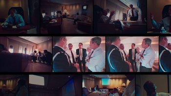 Movie still from “9/11: Inside the President's War Room” (2021), directed by Adam Wishart – A series of photographs of people in suits and ties; Wide shot, High angle