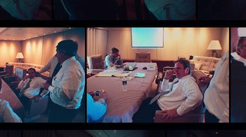Movie still from “9/11: Inside the President's War Room” (2021), directed by Adam Wishart – A group of people sitting around a table; Wide shot, Over the shoulder angle