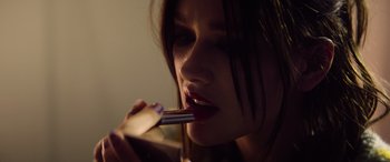 Movie still from “A Banquet” (2021), directed by Ruth Paxton – A person brushing her teeth; Extreme Close Up shot, Low angle