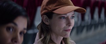 Movie still from “A Banquet” (2021), directed by Ruth Paxton – A person wearing a hat; Close Up shot, Low angle