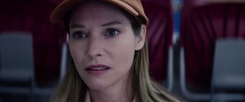 Movie still from “A Banquet” (2021), directed by Ruth Paxton – A person wearing a hat; Close Up shot, Low angle