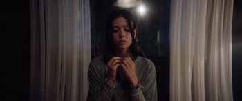 Movie still from “A Banquet” (2021), directed by Ruth Paxton – A woman with her hands in her mouth; Close Up shot, Low angle