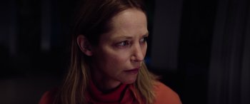 Movie still from “A Banquet” (2021), directed by Ruth Paxton – A person looking at the camera; Close Up shot, Low angle