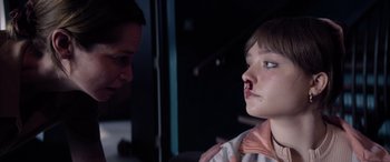 Movie still from “A Banquet” (2021), directed by Ruth Paxton – A man and a woman are looking at each other; Close Up shot, Over the shoulder angle
